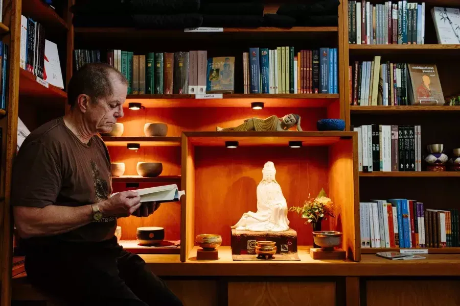 Dennis McNally reading in his office.