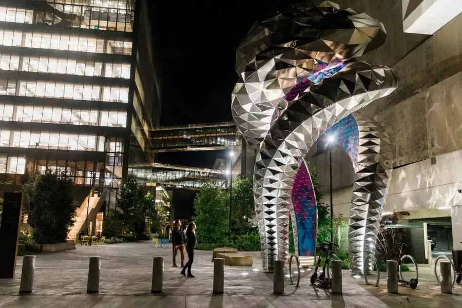 Pedestrians admire a large-scale work of public art, Futureforms, in Mission Bay, California.