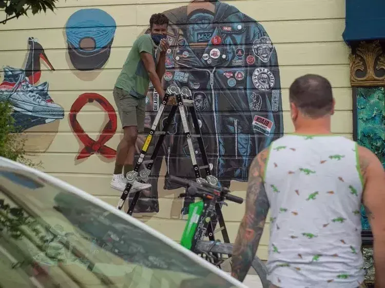 Serge Gay Jr painting his mural last year